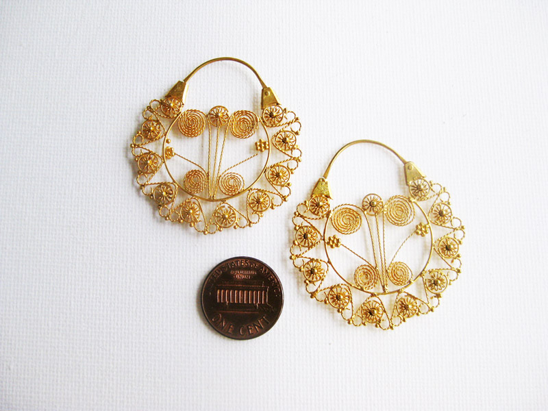 Reproduction earrings in a much bigger size.